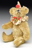 CIRCA 1912 VERY RARE CLOWN STYLE STEIFF RATTLE BEAR WITH BUTTON. A most unusual and delightful