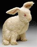 UNUSUAL AND HIGHLY COLLECTIBLE EARLY WHITE STEIFF RABBIT WITH BUTTON. Rabbit is sitting, unjointed