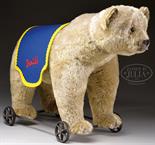 CIRCA 1912 BLOND STEIFF BEAR ON WHEELS WITH BUTTON. Bear is standing on all fours, hard stuffed