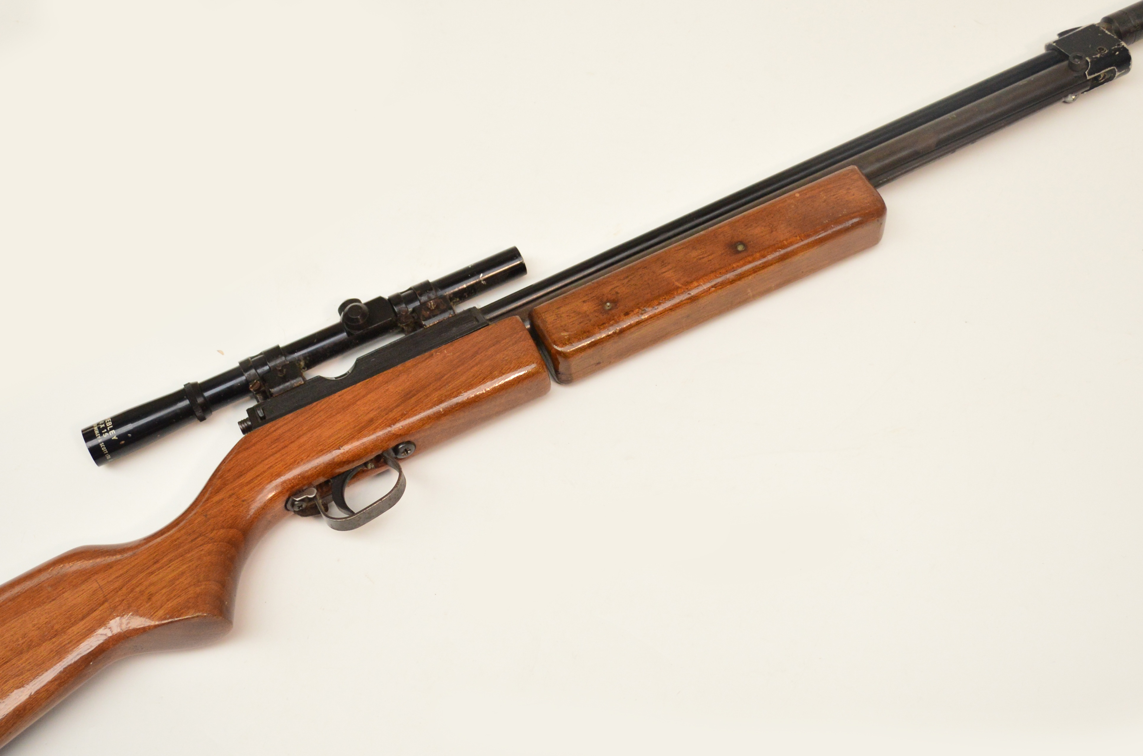 A SharpInnova .22 underlever pneumatic air rifle with scope and silencer.