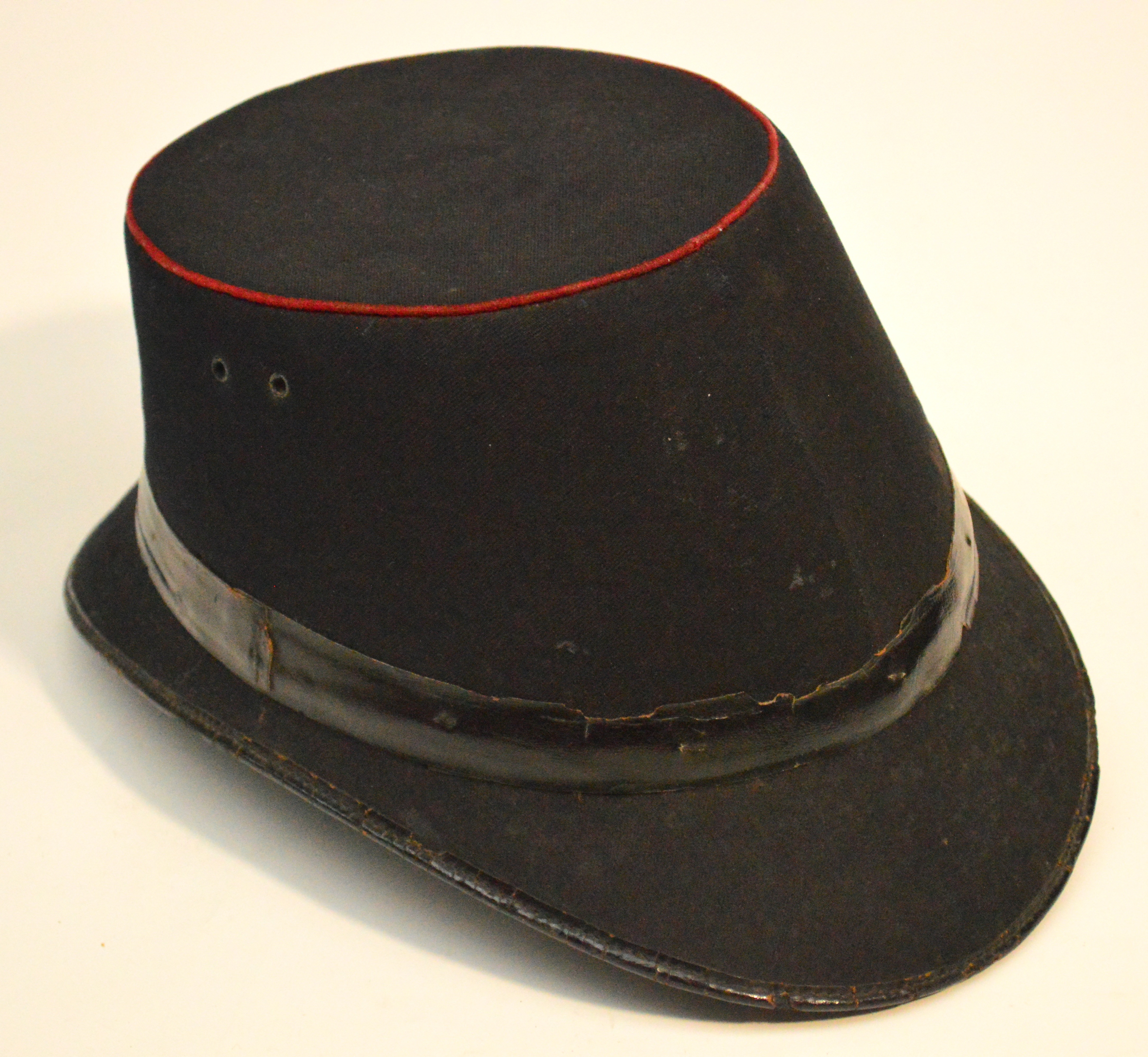 A vintage GPO postman's hat, dated 1914.