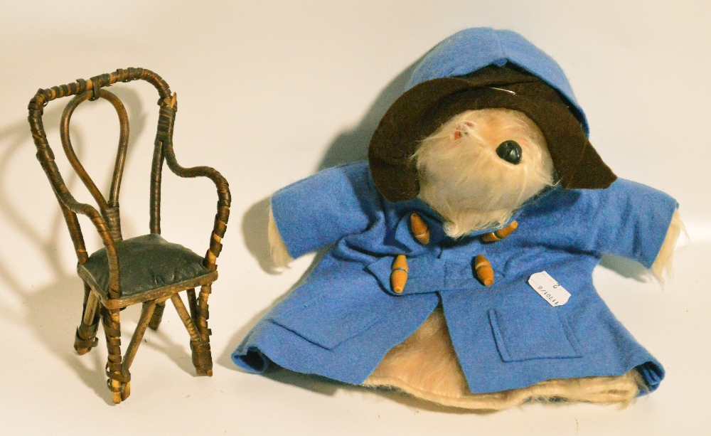 A vintage Paddington Bear hand puppet and a 19th century dolls house