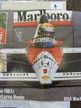 Motor Racing, A double A4 colour page, of and signed `To Mark, best wishes Ayrton Senna`, this is