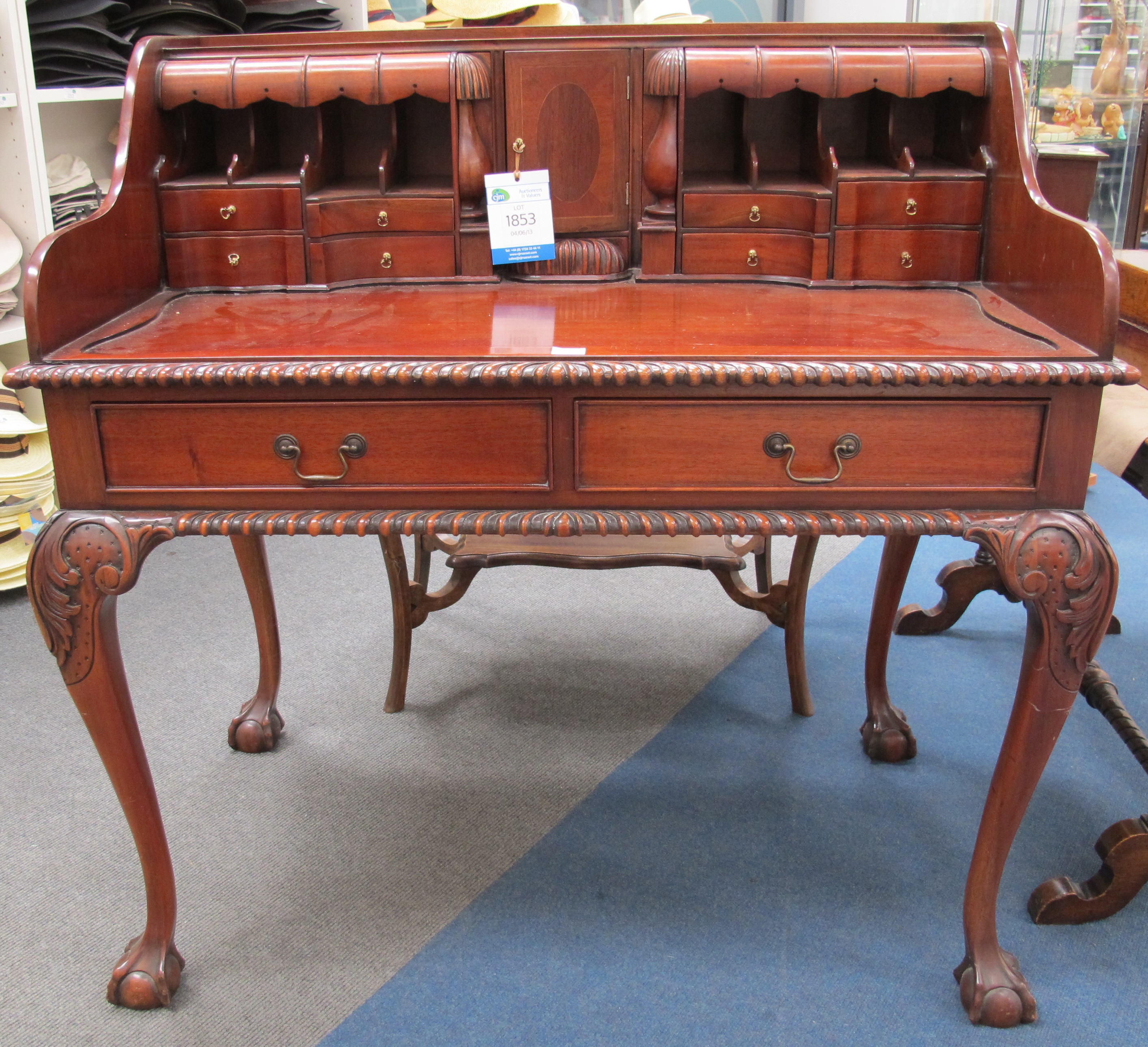 A Reproduction Mahogany Writing Desk With Numerous Drawers Pigeon