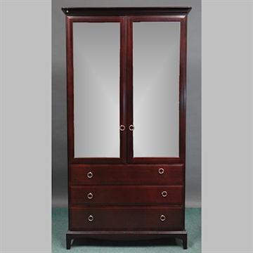 A Stag Minstrel Wardrobe With A Pair Of Mirrored Doors Above