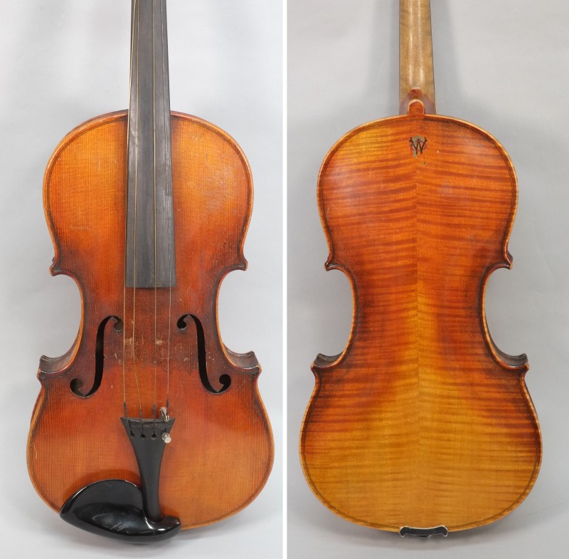 A late 19th century German violin: scroll carved headstock,ebony finger board and two piece flame
