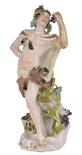 A GERMAN PORCELAIN FIGURE OF BACCHUS, PERHAPS MEISSEN, CIRCA 1760 draped in a goatskin, holding a