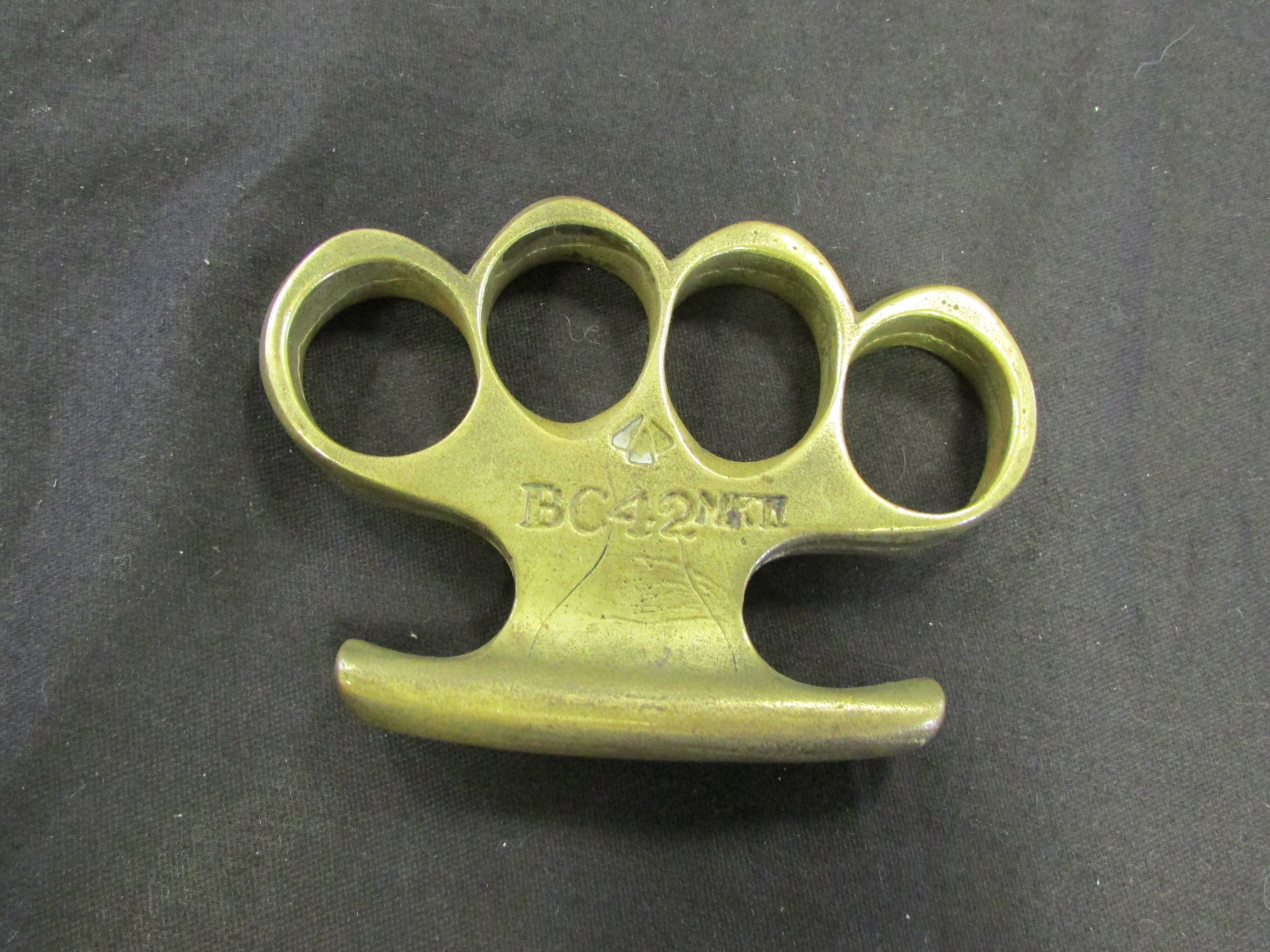 Knuckle Dusters a BC42 MkII stamped brass knuckle duster, very good