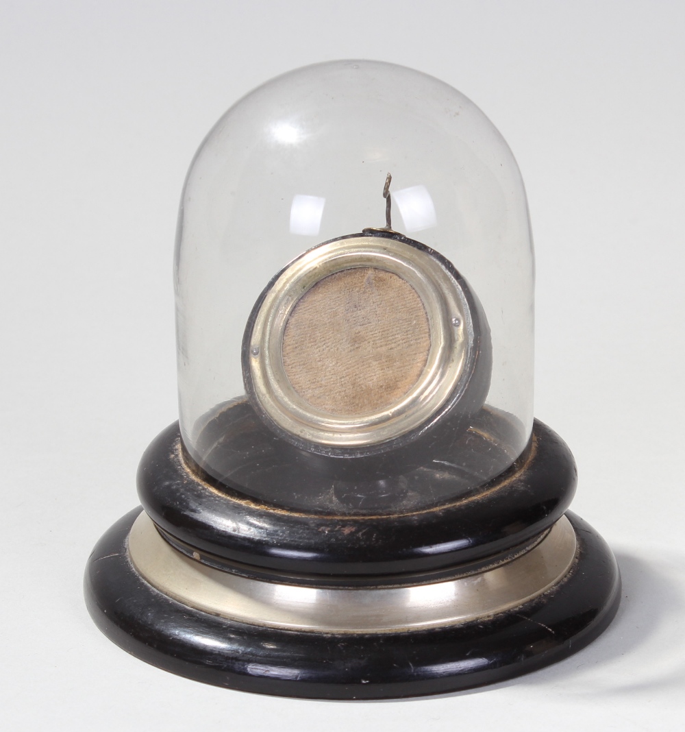 Late Victorian pocket watch display case, having hinged glass dome, enclosing hooked pocket watch