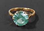 Yellow metal aquamarine set ring, set with single brilliant cut aquamarine in six claw mount, ring