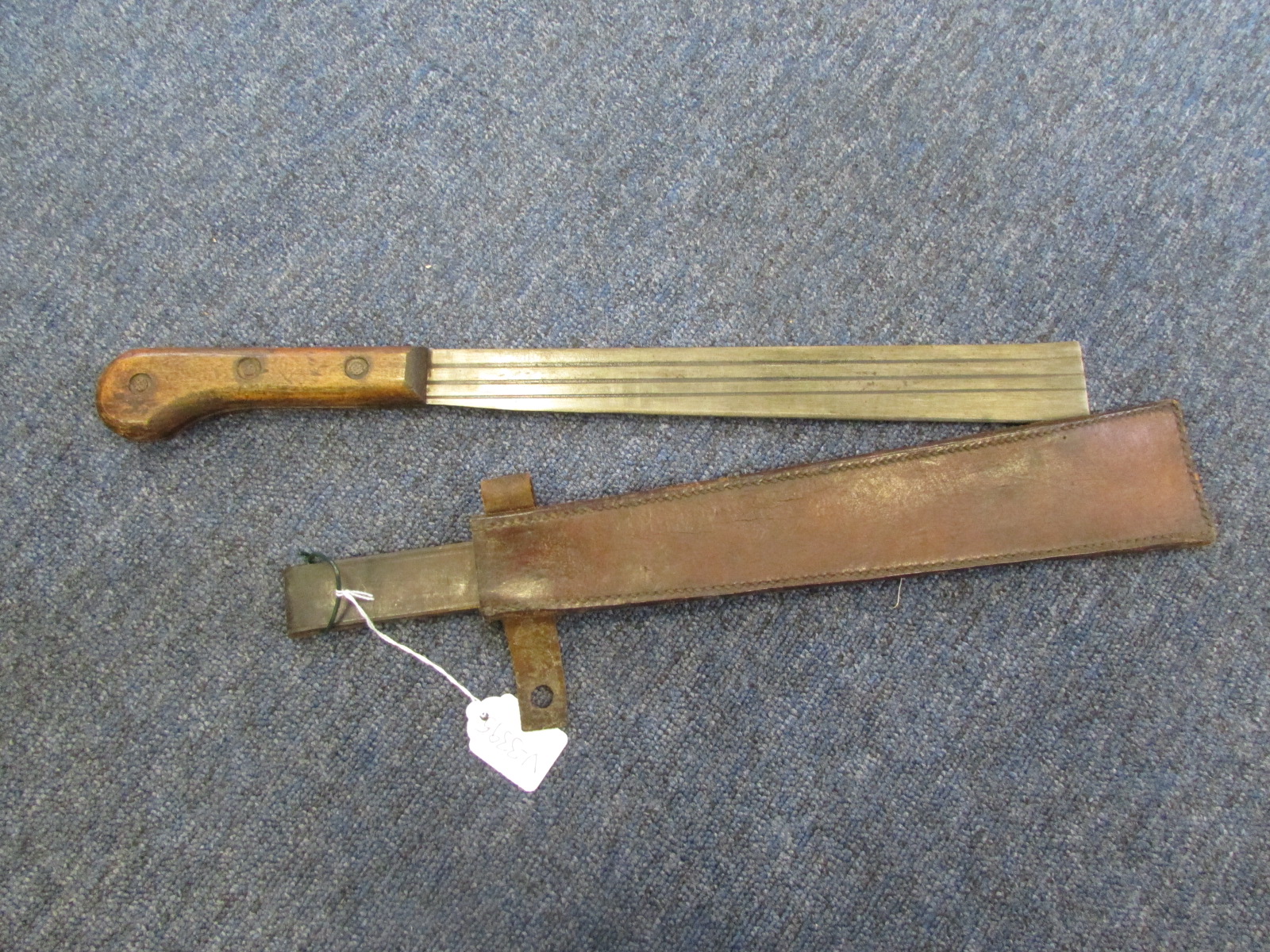 Machete A WW2 British WD marked Machete by A.J. DAVIDSON W/D arrow and dated 1944. Leather scab