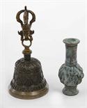 A BRONZE TABLE BELL, 
Tibetan, late 19th century, the handle in the form of a Buddhist head with