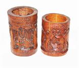 TWO SIMILAR CARVED CHINESE BAMBOO BRUSH POTS, 
depicting figures amongst trees, the tallest, 7.