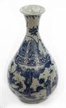 A CHINESE BLUE AND WHITE VASE, 
of bottle form, with flared neck, depicting figures in landscapes,