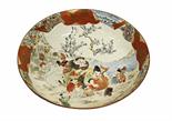 A large Japanese Satsuma bowl or basin, 19th century, depicting numerous figures fishing by a lake