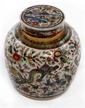 A CHINESE BLUE AND WHITE CLOBBERED GINGER JAR AND COVER, 
18th century, decorated with dragon in a