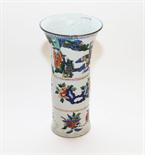 AN UNUSUAL CHINESE FAMILLE VERTE VASE,
with flared neck, decorated with genre scenes, on a three