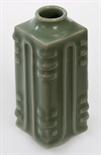 AN UNUSUAL CHINESE CELADON GROUND SQUARE RIBBED VASE, 
with short tapering neck on a conforming