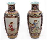 A PAIR OF UNUSUAL CHINESE BALUSTER SHAPED VASES, 
each with two decorated panels, painted with