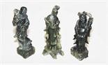 THREE SIMILAR CARVED SOAPSTONE FIGURES,
19th century, depicting two Immortals and a Guanyin, each