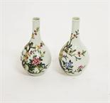 A PAIR OF ATTRACTIVE SMALL CHINESE FAMILLE ROSE BOTTLE VASES, 
each decorated with colourful flowers