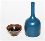 A CHINESE BOTTLE VASE,
in mottled blue monochrome, with tall cylindrical neck, square seal mark to