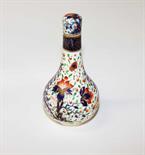 A DERBY IMARI STYLE PORCELAIN BOTTLE VASE AND COVER, early 19th century, decorated with flower and