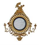 A REGENCY GILT GIRANDOLE, the ball and rope moulded frame crested with a stylised sea horse on