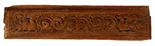 A CARVED TEAK RAJASTHANI HAVELI DOOR LINTEL, 19th century, the centre decorated with an urn with