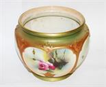 A ROYAL WORCESTER BOWL,
c.1900, with panels of colourful flowers, handpainted, against a green and