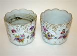 A PAIR OF FLORAL DECORATED DRESDEN PORCELAIN JARDINIERES,
early 20th century, each with a shaped and