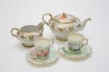 A TWENTY-FOUR PIECE PORCELAIN COFFEE SERVICE, 
comprising twelve attractive porcelain cups and