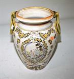 A CONTINENTAL TWO HANDLED POTTERY VASE, 
O.R.M., with anthemion handles, and decorated with