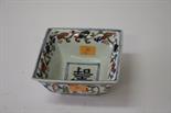 A SQUARE CHINESE FAMILLE VERTE PORCELAIN BOWL, of flared form, decorated with figures and animals,