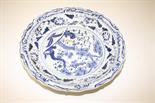 A LARGE CHINESE BLUE AND WHITE DISH, 
decorated with foliage, inside a wavy rim, 23in (59cm). (1)