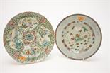 AN 18TH CENTURY CHINESE PLATE, 
decorated with flowers, within a pale border, 9in (23cm), together