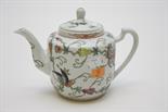 A CHINESE PORCELAIN TEA POT, 
20th century, decorated with butterflies and flowers, 6.25in (