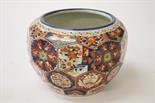 A JAPANESE IMARI JARDINIÈRE,
O.R.M., with hexagonal panels, decorated
with flowers and other motifs,