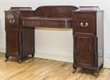 A GEORGE IV PERIOD MAHOGANY PEDESTAL SIDEBOARD
probably Irish, of small proportions, with arched and