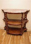 A VICTORIAN THREE TIER SERPENTINE SHAPED WALNUT WHATNOT
with rouge and speckled marble top on open