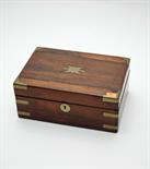 A REGENCY BRASS BOUND ROSEWOOD BOX
with rectangular hinged cover and two division interior, 12in (