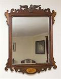 AN INLAID MAHOGANY AND PARCEL GILT PIER MIRROR
in the George III style, early 20th century, the fret