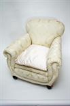 A PAIR OF WALNUT EASY ARMCHAIRS
each covered in attractive ivory fabric, on front bun feet. (2)