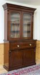 A VICTORIAN MAHOGANY SECRETAIRE BOOKCASE
the moulded cornice above two arched and glazed doors,