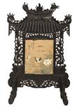 A CARVED JAPANESE HARDWOOD CHEVAL SCREEN
Meiji Period, of pagoda form, the centre with signed