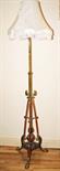 A TELESCOPIC COPPER MOUNTED BRASS STANDARD LAMP
Edwardian, converted for electricity, on a tripod