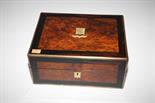 A VICTORIAN BIRD'S EYE MAPLE AND ROSEWOOD BANDED VANITY CASE
the interior with fitted glass bottles,