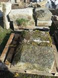 A QUANTITY OF EARLY CUT LIMESTONE PLINTHS, six sections; together with a small lintel (contained