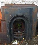 FIVE VARIOUS HEAVY CAST IRON FIREPLACE INSETS, the majority with arched fronts. (5)