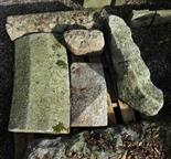 SIX PIECES OF CUT GRANITE, including a large window sill, a curved wall capping, half a pillar cap